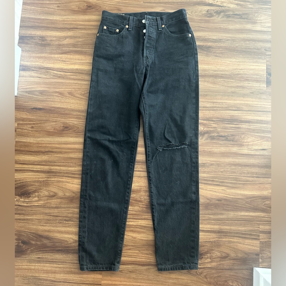Levi 501s - size 25 - straight leg - one left knee slit